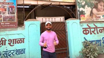 Ajinkya Rahane poses in front of his school 