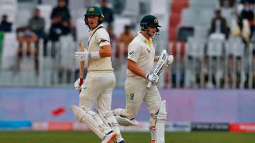 Australia's Steve Smith, right, and Marnus Labuschagne run between the wickets during the 3rd day of the first cricket test match between Pakistan and Australia at the Pindi Stadium, in Rawalpindi, Pakistan, Sunday, March 6, 2022. 