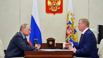 Russian President Vladimir Putin, left, listens to RUSNANO CEO Anatoly Chubais in the Novo-Ogaryovo residence, outside Moscow, Russia, Monday, Nov. 7, 2016. The resignation of Chubais, who was Putin's envoy to international organizations for sustainable development, was not the first resignation of a state official over the war with Ukraine, but it was one of the most striking. 