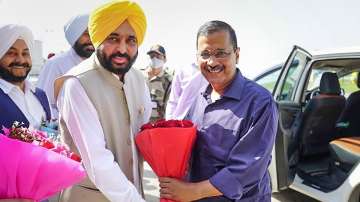 Punjab CM-designate Bhagwant Mann receives AAP national convenor Arvind Kejriwal at Amritsar airport.
