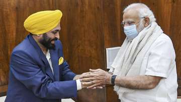 Prime Minister Narendra Modi and Punjab Chief Minister Bhagwant Mann greet each other, during their meeting, in New Delhi.