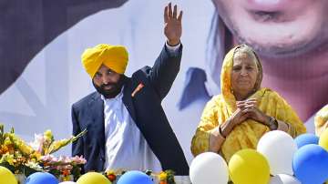 AAP's Punjab CM candidate Bhagwant Mann waves at supporters during a rally to celebrate the partys win in Assembly polls, at Dhuri, in Sangrur, Thursday, March 10, 2022. 