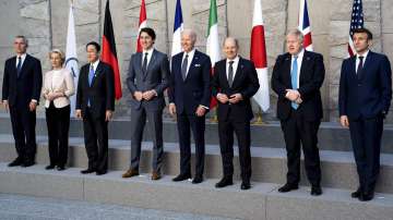 From left, NATO Secretary General Jens Stoltenberg, European Commission President Ursula von der Leyen, Japan's PM Fumio Kishida, Canada's PM Justin Trudeau, President Joe Biden, German Chancellor Olaf Scholz, British PM Boris Johnson and French President Emmanuel Macron pose for a G7 leaders group photo during a NATO summit in Brussels, Belgium, Thursday, March 24, 2022.