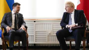 Britain Prime Minister Boris Johnson and Ukrainian President Volodymyr Zelensky meet for talks during the Munich Security Conference in Munich, Germany, Saturday, Feb. 19, 2022.