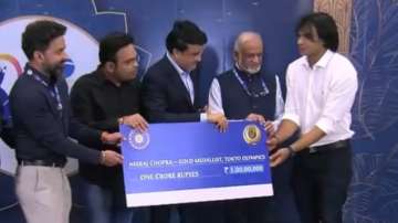 Board handed Chopra a cheque of Rs 1 crore