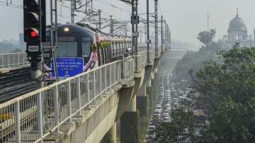 A special driverless train runs on the Delhi Metro Pink Line after its virtual flagging off ceremony, in New Delhi, Thursday, Nov. 25, 2021.