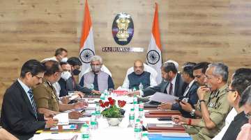 Union Home Minister Amit Shah with J&K Lt. Governor Manoj Sinha and other dignitaries, during a meeting to review the security situation in Jammu and Kashmir, in Jammu.?