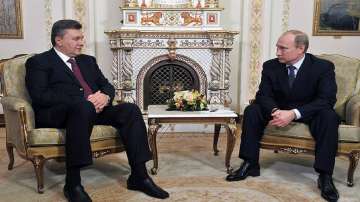 Former Ukraine President Victor Yanukovych with Russian President Vladimir Putin. 