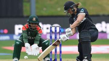 New Zealand's Suzie Bates plays a shot as Bangladesh wicket-keeper Shamima Sultana looks on during t