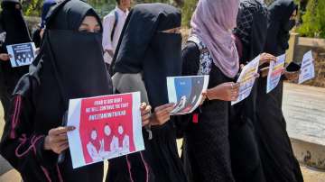 Muslim students wearing burqa protest against the Karnataka High Courts verdict on Hijab by boycotting their internal exams in front of IDSG college, in Chikmagalur, Wednesday, March 16, 2022.?
