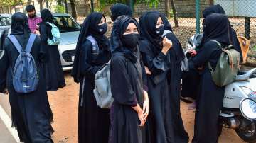 Students leave after they were not allowed to attend classes while wearing Hijab at a college in Udupi. 