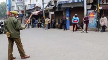 Police personnel patrol during the COVID-induced restrictions in Jammu. 