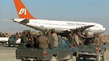 Taliban fighters surrounded the plane that was forced to land at the Kandahar airport in 1999. 