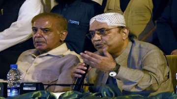 Pakistani opposition leaders Asif Ali Zardari (right), and Shahbaz Sharif give a press conference about the country's latest political situation, in Islamabad, Pakistan, Monday, March 28, 2022.