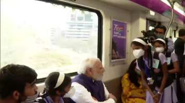 PM Modi inaugurates, travel in Pune Metro.