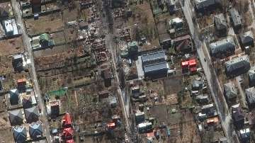 This satellite image provided by Maxar Technologies shows a close up of destroyed military vehicles and homes at a residential area south of Antonov airport in Bucha, Ukraine on Feb. 28, 2022.