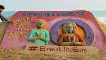 Sand artist Manas Sahoo makes a sculpture on the occasion of International Women's Day, in Puri, Monday, March 7, 2022.
