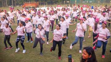 Women participate in a Zumba session during a pink marathon organised by Noida Authority, on the occasion of International Women's Day, at a stadium, in Noida, Tuesday, March 8, 2022.