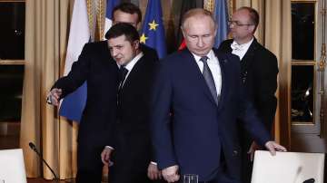 Russian President Vladimir Putin, right, and Ukrainian President Volodymyr Zelenskyy