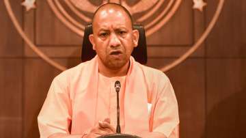 Uttrar Pradesh Chief Minister Yogi Adityanath addresses a press conference after holding the first Cabinet meeting, in Lucknow, Saturday, March 26, 2022.