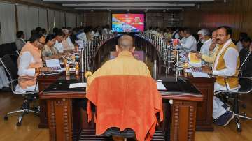 Yogi Adityanath during a meeting related to 100-day development action plan, in Lucknow, Thursday, April 21, 2022.
