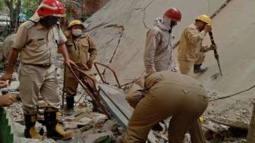An under-construction building collapses in Delhi's Satya Niketan area.