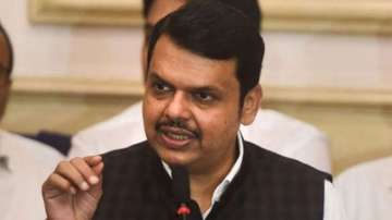 BJP leader Devendra Fadnavis has dared the state government to charge him and his party workers if chanting Hanuman Chalisa is "anti-national".  