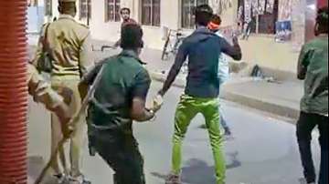 An unidentified person attacks constables at Gorakhnath Temple gate, on Sunday night, April 3.