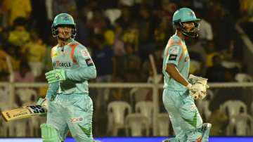 LSG opening batsman de Kock and Rahul running between the wicket