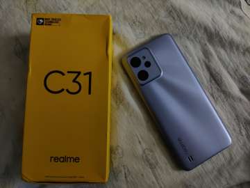 Realme C31, along with the box.
