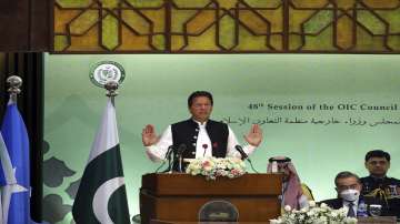 Pakistan's Prime Minister Imran Khan speaks at the start of a two-day gathering of the 57-member Organization of Islamic Cooperation, at the Parliament House in Islamabad, Pakistan