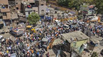 Bulldozers being used to remove illegal structures during an anti-encroachment drive in Delhi's Jahangirpuri.