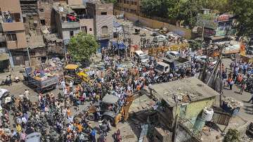 Bulldozers being used to remove illegal structures during a joint anti-encroachment drive by NDMC, PWD, local bodies and the police, in the violence-hit Jahangirpuri area, in New Delhi.
