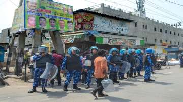 Rapid Action Force keep vigil after clashes broke out between two communities during a Hanuman Jayanti procession on Saturday at Jahangirpuri in New Delhi.