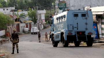 Security personnel during an encounter with militants, at Sunjawan area in Jammu, Friday, April 22, 2022.