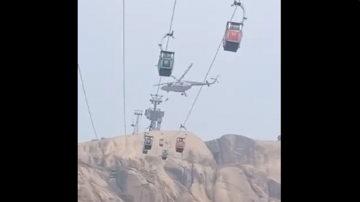 A 22-year-old local rescued eight tourists who were trapped in two cable cars.?