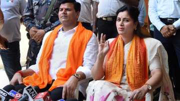 Amravati MP Navneet Kaur Rana with husband MLA Ravi Rana addresses a press conference, in Mumbai