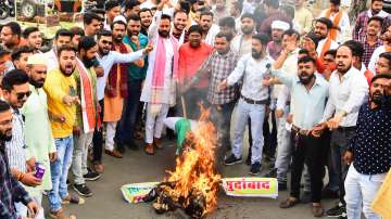 BJP Yuva Morcha members burn an effigy of Digvijaya Singh over his tweet on Khargone violence, in Jabalpur, Tuesday, April 12, 2022.