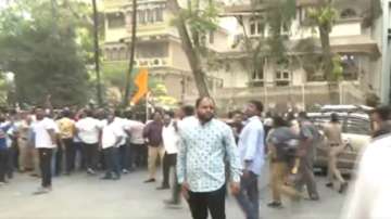 Shiv Sena workers protest outside the residence of Amravati MP Navneet Rana in Mumbai.