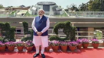 Prime Minister Narendra Modi poses for photos during the inauguration ceremony of Pradhan Mantri Sangrahalaya, in New Delhi.