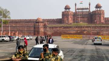 Security personnel stand guard outside the historic Red Fort.