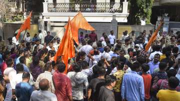 Shiv Sena workers outside MLA Ravi Rana and Navneet Kaur's residence at Khar in Mumbai, Saturday, April 23, 2022.