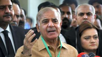 Pakistan's opposition leader (now PM) Shahbaz Sharif talks to reporters outside the Supreme Court prior to a petition hearing for dissolving parliament by countrys Prime Minister, in Islamabad, Pakistan, on Tuesday.