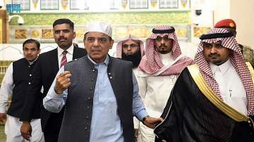 Prime Minister of Pakistan Shahbaz Sharif, third left, visits Prophet Muhammad’s mosque in the holy city of Medina in western Saudi Arabia and performs prayers with his delegation late Thursday, April 28, 2022.
 