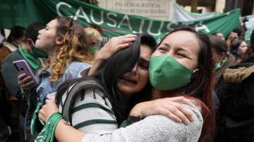 Abortion-rights activists celebrate after the Constitutional Court approved the decriminalisation of abortion, lifting all limitations on the procedure until the 24th week of pregnancy, in Bogota, Colombia