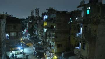 Buildings of a residential society in the dark following a power outage, at Jangpura in New Delhi.