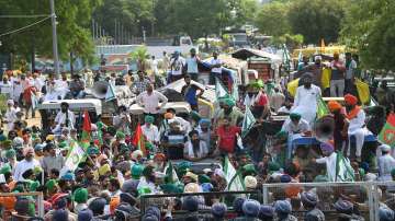 Farmers of the Sanyukt Kisan Morcha protest near Chandigarh-Mohali border after being stopped from heading towards Chandigarh, in Mohali.