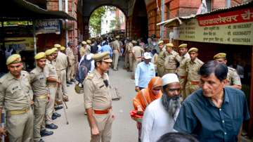 Security personnel outside the court during hearing of the Gyanvapi mosque survey case, in Varanasi, Tuesday, May 10, 2022.