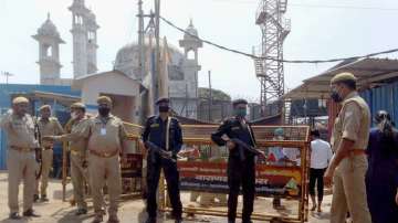 Cops and commandos stand guard outside Gyanvapi Mosque. 