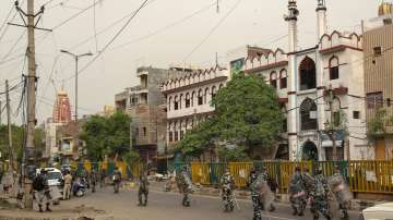 Paramilitary Force personnel patrol during Eid-al-Fitr, at Jahangirpuri in New Delhi, Tuesday, May 3, 2022.